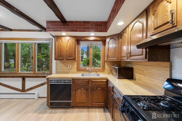 40 Montclair Ave, Edison, NJ 08820 - kitchen featuring black appliances, a sink, light countertops, decorative backsplash, and a baseboard radiator