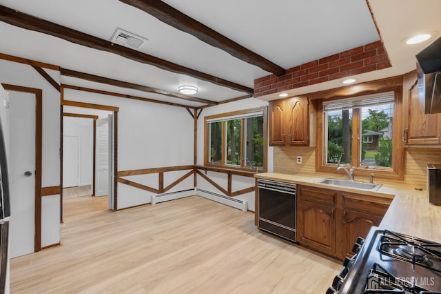 40 Montclair Ave, Edison, NJ 08820 - kitchen with black appliances, a sink, light countertops, light wood-style flooring, and tasteful backsplash