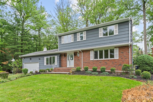40 Montclair Ave, Edison, NJ 08820 - view of front of home featuring an attached garage, a front lawn, and brick siding