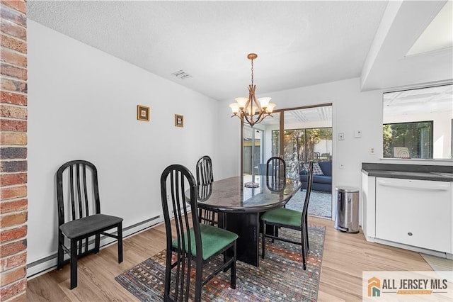 21 Celtis Plz Unit 21B, Monroe, NJ 08831 - dining room featuring light wood finished floors and a chandelier