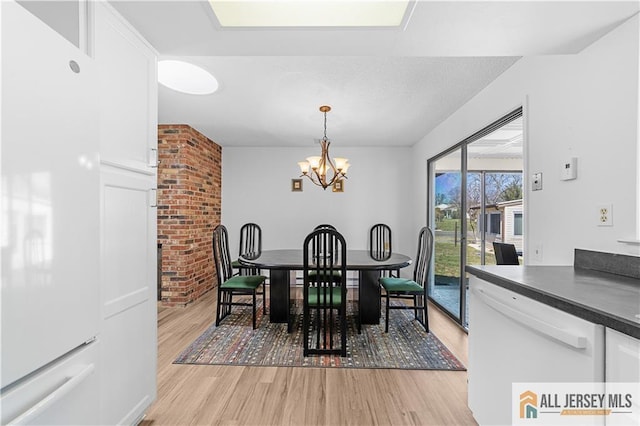 21 Celtis Plz Unit 21B, Monroe, NJ 08831 - dining room with light wood-type flooring and a chandelier