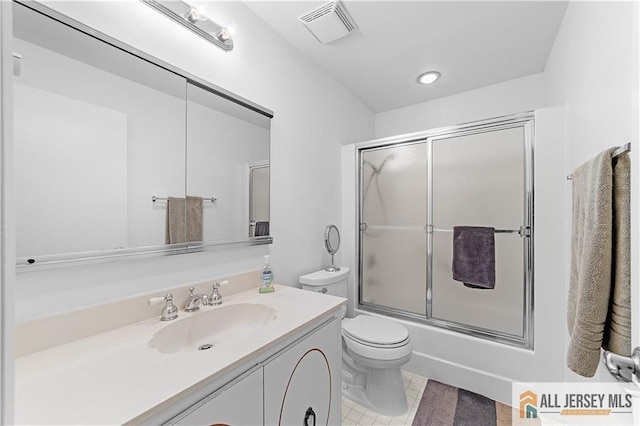 21 Celtis Plz Unit 21B, Monroe, NJ 08831 - full bathroom featuring toilet, vanity, bath / shower combo with glass door, and tile patterned floors