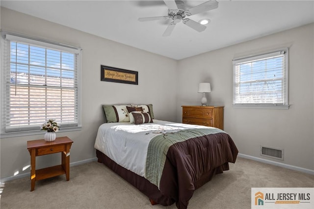 bedroom featuring visible vents, ceiling fan, baseboards, and carpet floors