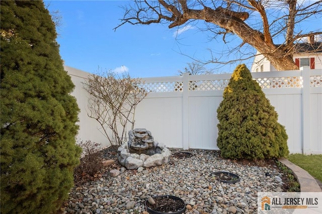 view of side of home with fence