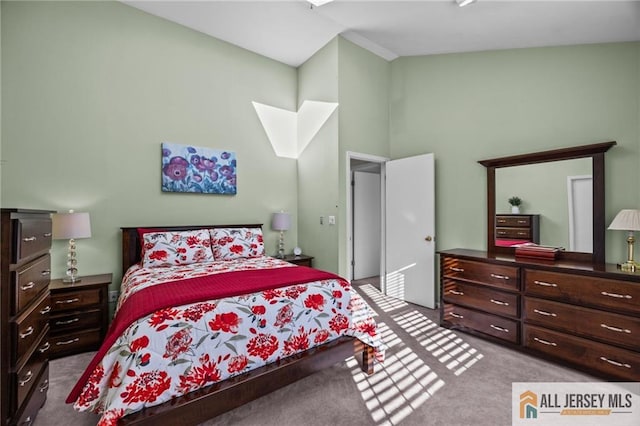 bedroom featuring a high ceiling and carpet