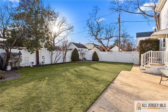 view of yard featuring a patio area and a fenced backyard