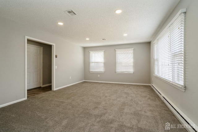 474 Revere Way Unit N, Monroe, NJ 08831 - carpeted spare room with a baseboard radiator, a textured ceiling, recessed lighting, and baseboards