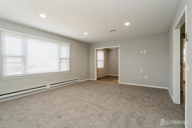 474 Revere Way Unit N, Monroe, NJ 08831 - unfurnished bedroom featuring a baseboard radiator, carpet, recessed lighting, a textured ceiling, and baseboards