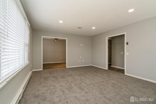 474 Revere Way Unit N, Monroe, NJ 08831 - spare room featuring carpet, a baseboard heating unit, recessed lighting, a textured ceiling, and baseboards