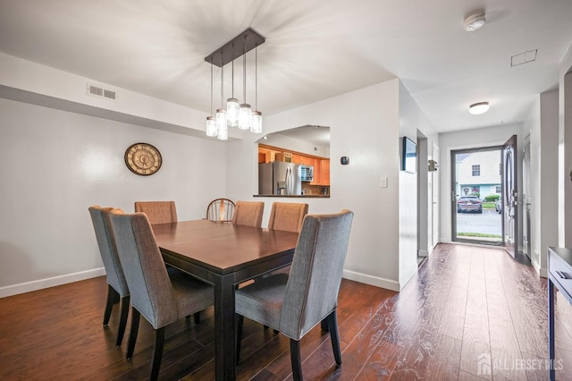 835 Darlington Dr, Old Bridge, NJ 08857 - dining space with dark wood-style flooring and a chandelier