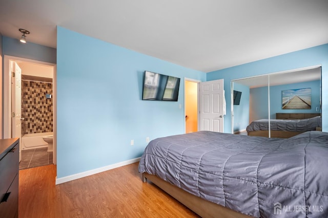 835 Darlington Dr, Old Bridge, NJ 08857 - bedroom with wood finished floors, a closet, and connected bathroom