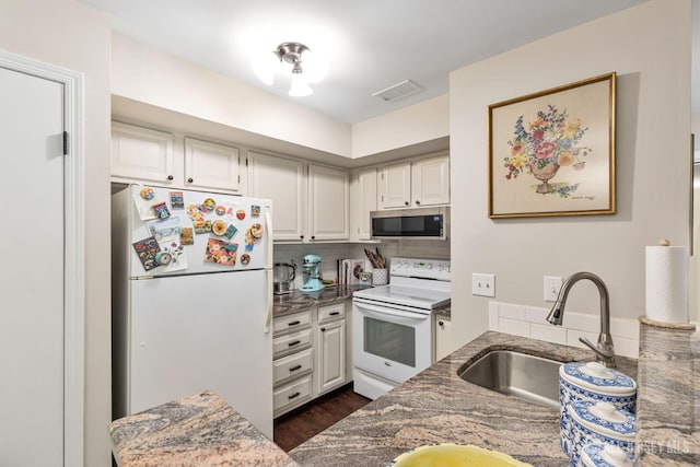29 Tansy Ct, Bedminster, NJ 07921 - kitchen featuring white appliances, a sink, dark wood-style flooring, tasteful backsplash, and white cabinets