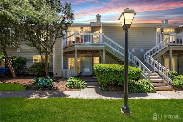 29 Tansy Ct, Bedminster, NJ 07921 - view of front of home with stairway, a yard, a chimney, and a wooden deck