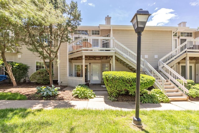 29 Tansy Ct, Bedminster, NJ 07921 - rear view of property featuring a chimney, stairway, and a wooden deck