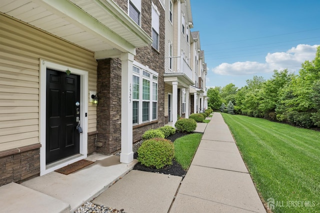 1525 Hudson Cir, Highland Park, NJ 08904 - entrance to property featuring stone siding and a yard