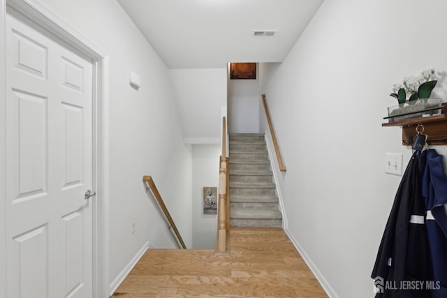 1525 Hudson Cir, Highland Park, NJ 08904 - staircase with wood finished floors and baseboards