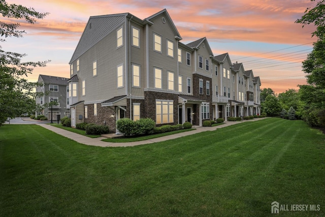 1525 Hudson Cir, Highland Park, NJ 08904 - view of front facade with stone siding and a front yard