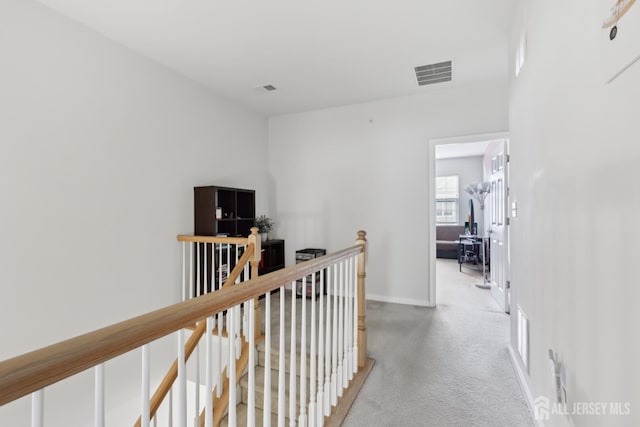 1525 Hudson Cir, Highland Park, NJ 08904 - hall with an upstairs landing, light carpet, and baseboards