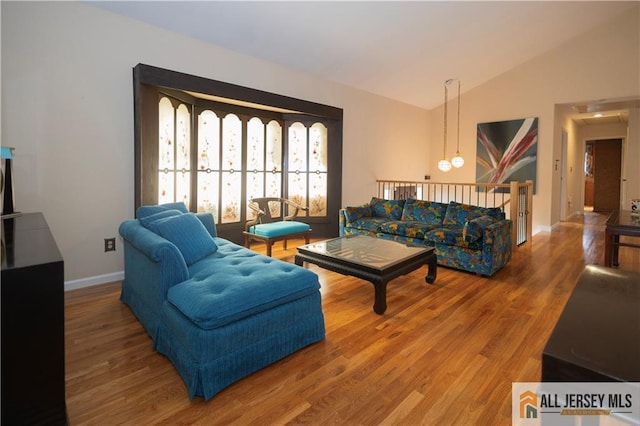 12 Tompkins Rd, East Brunswick, NJ 08816 - living area featuring wood finished floors and lofted ceiling