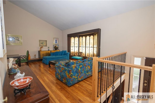 12 Tompkins Rd, East Brunswick, NJ 08816 - living area featuring wood finished floors and high vaulted ceiling