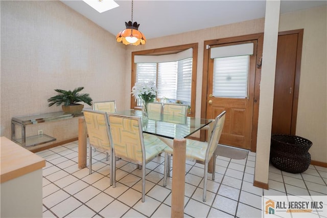 12 Tompkins Rd, East Brunswick, NJ 08816 - dining room with light tile patterned floors and a skylight