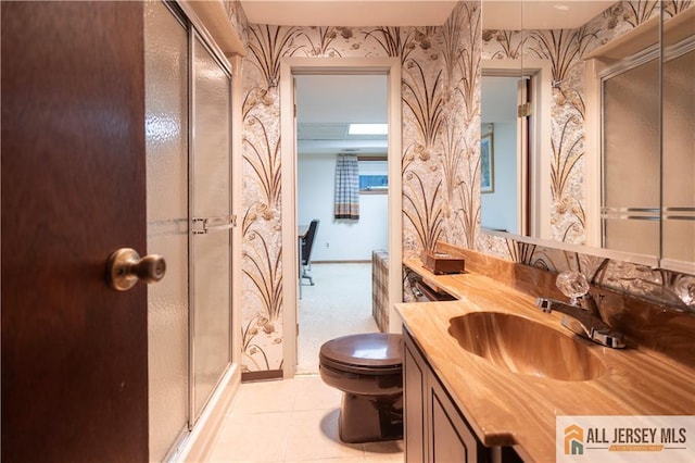 12 Tompkins Rd, East Brunswick, NJ 08816 - bathroom with wallpapered walls, vanity, a shower stall, and tile patterned flooring