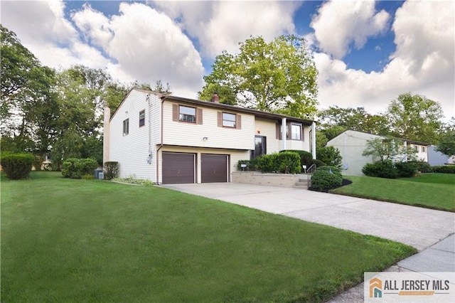 12 Tompkins Rd, East Brunswick, NJ 08816 - split foyer home with a chimney, a garage, a front lawn, and driveway