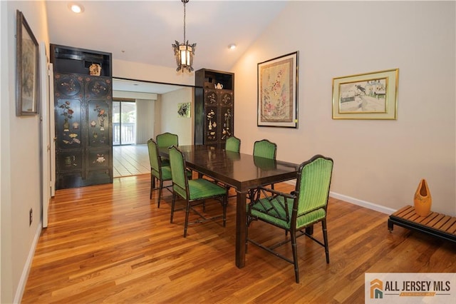 12 Tompkins Rd, East Brunswick, NJ 08816 - dining space with wood finished floors, a chandelier, lofted ceiling, and recessed lighting