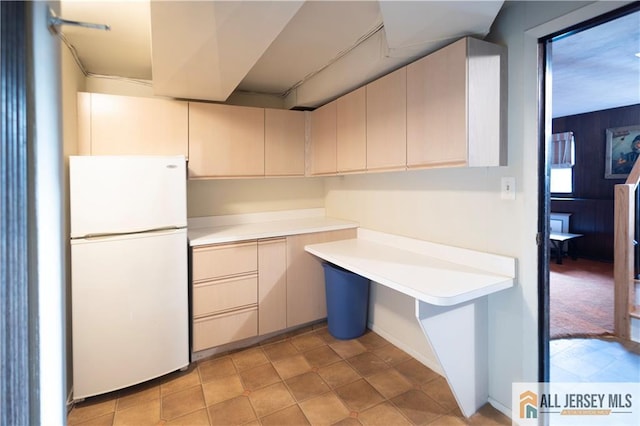 12 Tompkins Rd, East Brunswick, NJ 08816 - kitchen featuring freestanding refrigerator, light countertops, and cream cabinetry