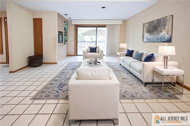 12 Tompkins Rd, East Brunswick, NJ 08816 - living room with light tile patterned flooring and baseboards