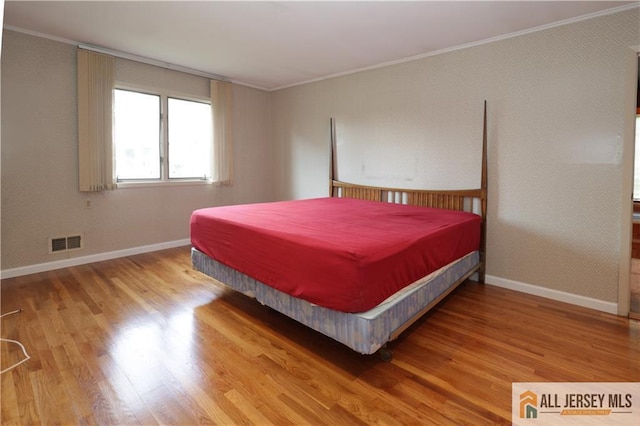 12 Tompkins Rd, East Brunswick, NJ 08816 - bedroom with wood finished floors and ornamental molding