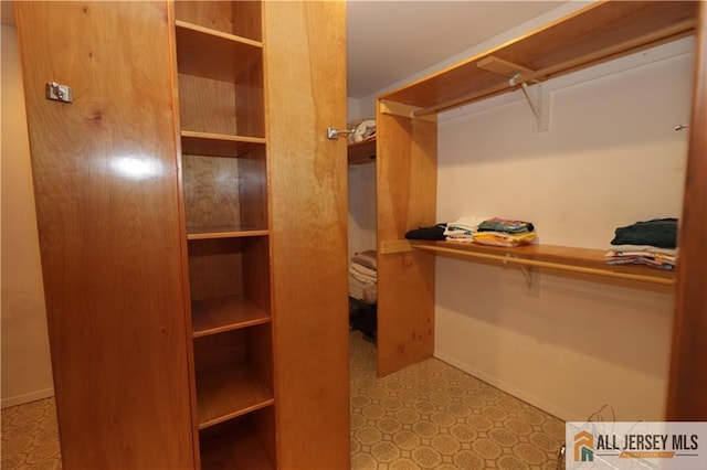 12 Tompkins Rd, East Brunswick, NJ 08816 - walk in closet featuring tile patterned floors