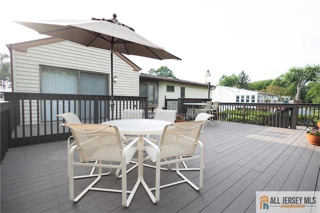 12 Tompkins Rd, East Brunswick, NJ 08816 - wooden deck featuring outdoor dining space
