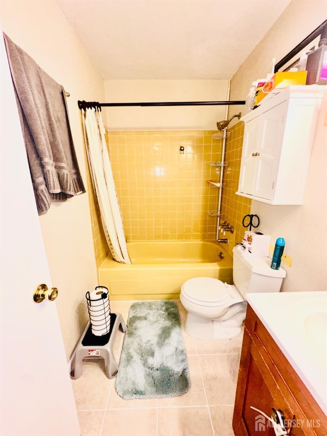 full bathroom with vanity, shower / bath combo, tile patterned floors, and toilet