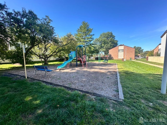 view of play area with a yard