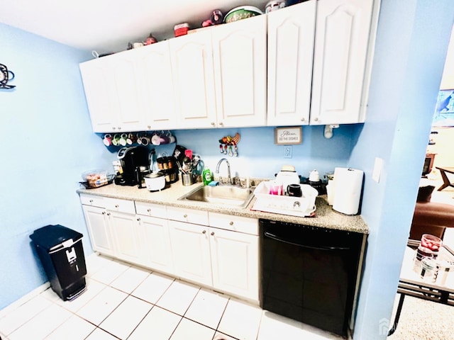 kitchen with light tile patterned floors, black dishwasher, sink, and white cabinets