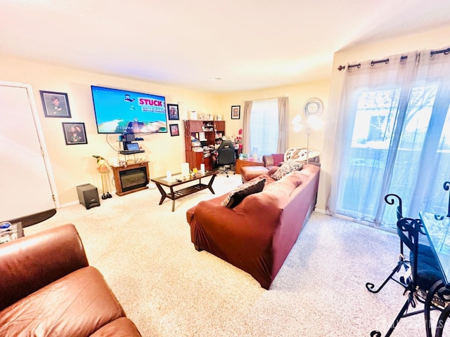 living room with a healthy amount of sunlight and light carpet