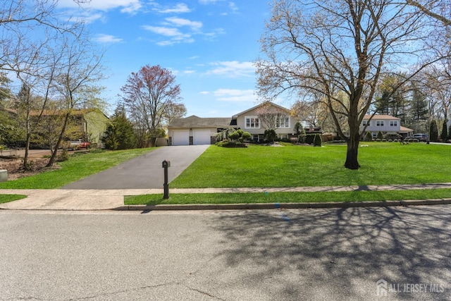 7 Arthurs Ct, Manalapan, NJ 07726 - view of front facade with an attached garage, a front lawn, and driveway