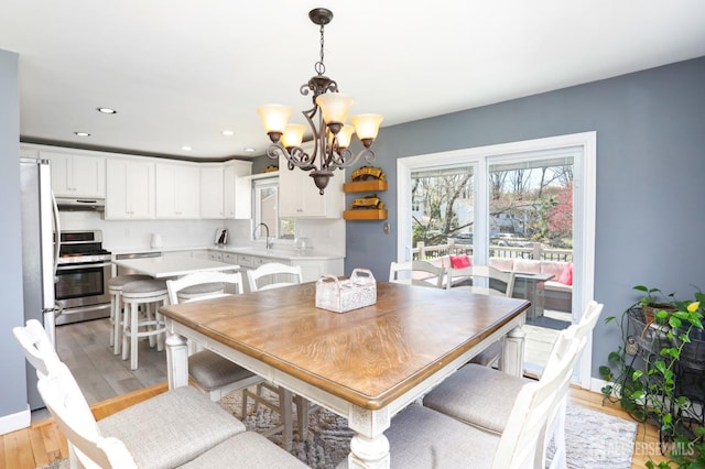 7 Arthurs Ct, Manalapan, NJ 07726 - dining room with a chandelier, light wood-type flooring, recessed lighting, and baseboards