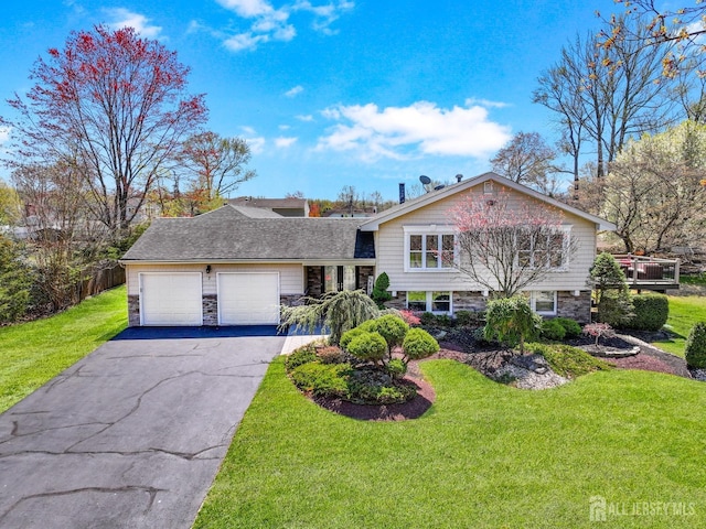 7 Arthurs Ct, Manalapan, NJ 07726 - tri-level home featuring a garage, stone siding, asphalt driveway, and a front yard