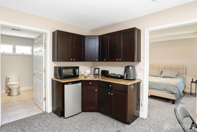 7 Arthurs Ct, Manalapan, NJ 07726 - kitchen with black microwave, dark brown cabinetry, and light colored carpet