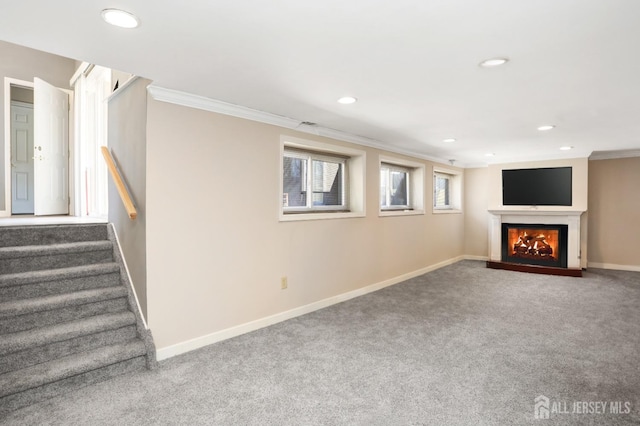 7 Arthurs Ct, Manalapan, NJ 07726 - basement with ornamental molding, baseboards, a warm lit fireplace, carpet floors, and recessed lighting