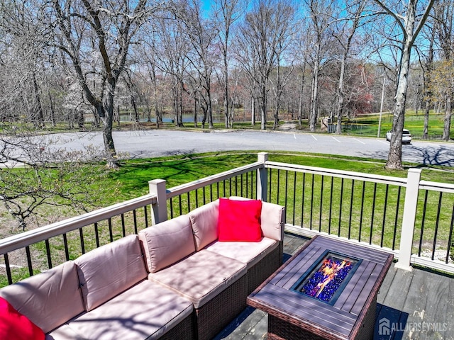 7 Arthurs Ct, Manalapan, NJ 07726 - wooden terrace featuring an outdoor living space with a fire pit, a water view, view of scattered trees, and a lawn