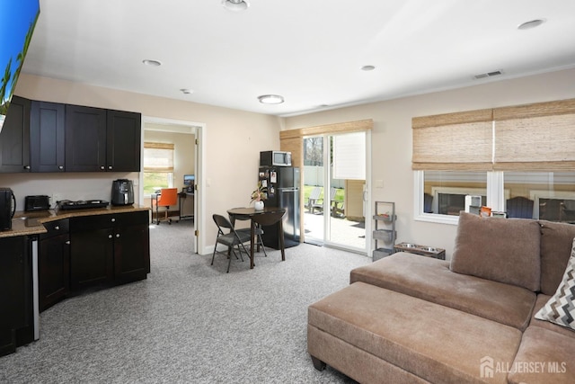 7 Arthurs Ct, Manalapan, NJ 07726 - living room featuring light carpet, plenty of natural light, and baseboards