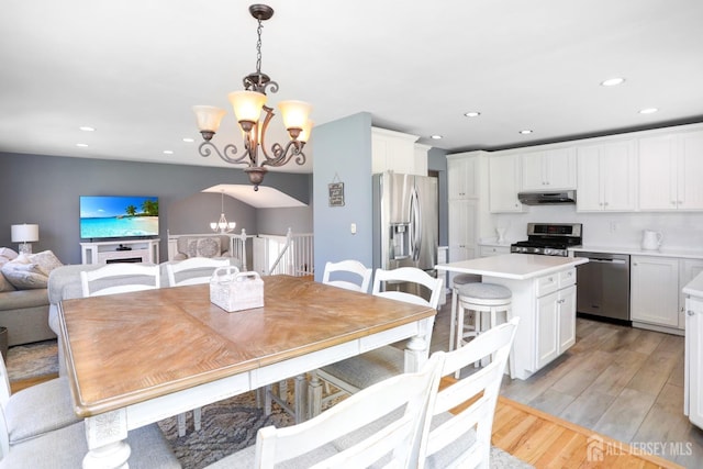 7 Arthurs Ct, Manalapan, NJ 07726 - dining space featuring a chandelier, light wood-style flooring, and recessed lighting