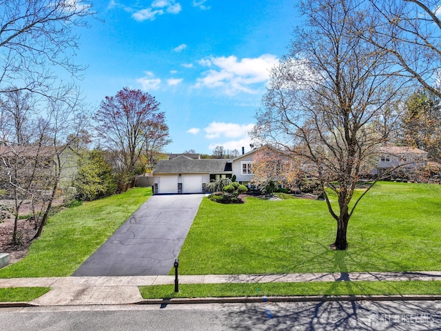 7 Arthurs Ct, Manalapan, NJ 07726 - tri-level home featuring a garage, a front yard, and driveway