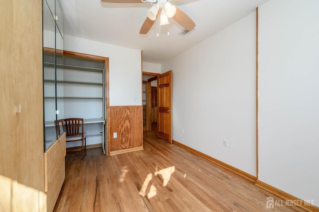 unfurnished bedroom featuring light hardwood / wood-style floors and ceiling fan