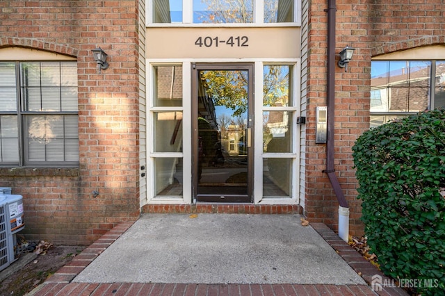 entrance to property with brick siding