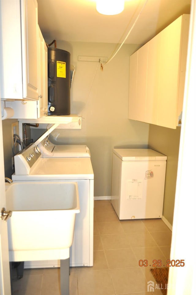 9-B Melborn Dr Unit 9B, Monroe, NJ 08831 - laundry room with cabinet space, washing machine and dryer, water heater, and light tile patterned floors