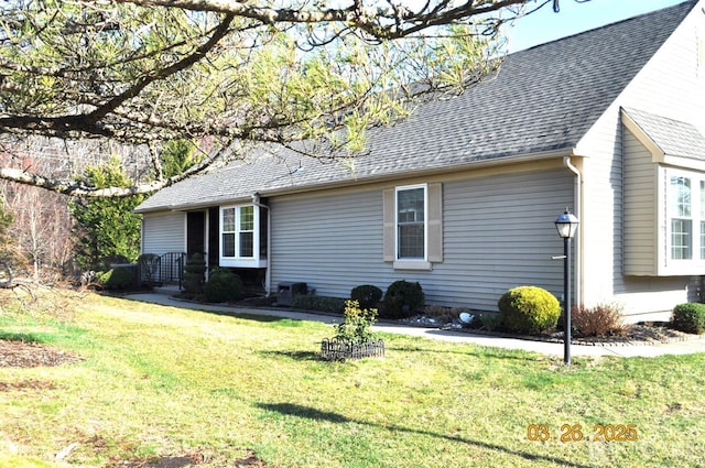 9-B Melborn Dr Unit 9B, Monroe, NJ 08831 - view of side of home with a yard and roof with shingles